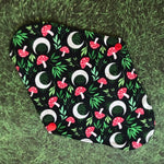This print features charming red amanita mushrooms, graceful green ferns, and big white crescent moons.