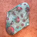 Reusable Menstrual Pad, with the decorative back facing the viewer.  
