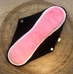  Reusable Menstrual Pad, with the comfortable interior side facing the viewer.  