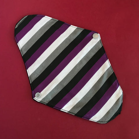 This cloth liner is striped in the asexual pride flag colors.